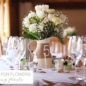 curradine barns wedding flowers centrepieces jugs