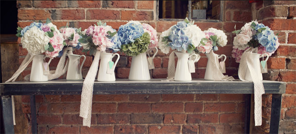 bridesmaids bouquets in jugs shustoke farm barns summer wedding florist passion for flowers