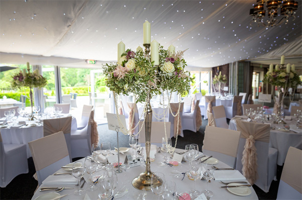 hogarths hotel wedding flowers candelabra tall centrepieces