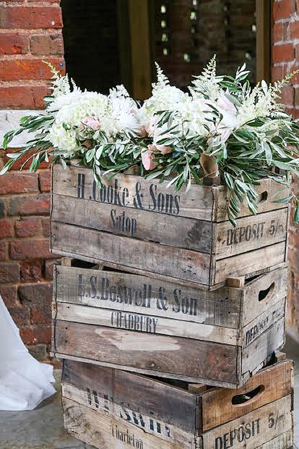 shustoke farm barns wedding flowers passion for flowers wooden rustic crates with flowers in barn