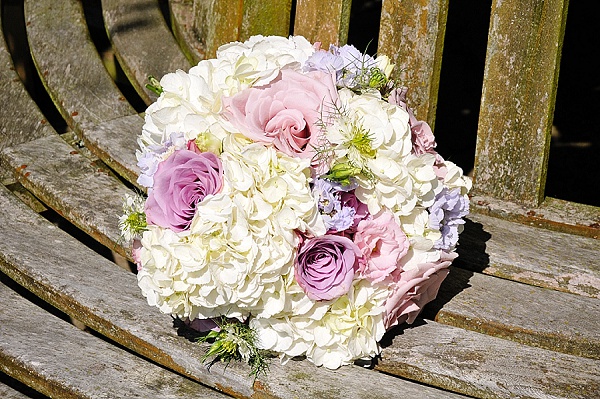 cream hydrangeas pink roses purple flowers wedding bouquets