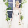 green foliage whimsical delicate floral garland archway wedding