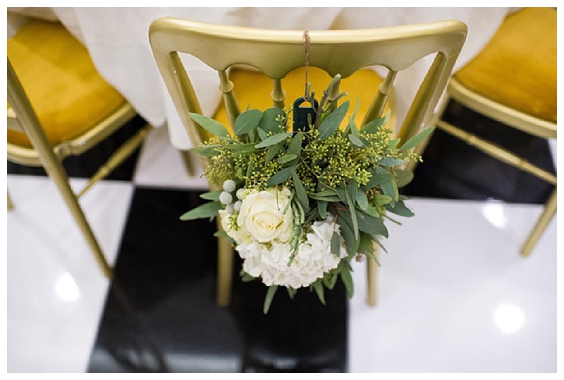 gold-white-green-wedding-flowers-chair-backs