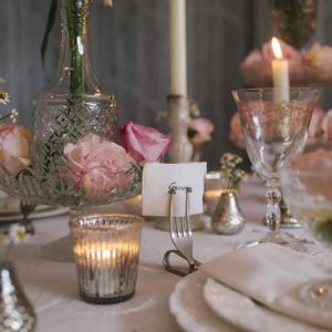 Elegant wedding table centres blush pink roses in clear glass crystal bowls vases decanters cake stands by Passion for Flowers (2)