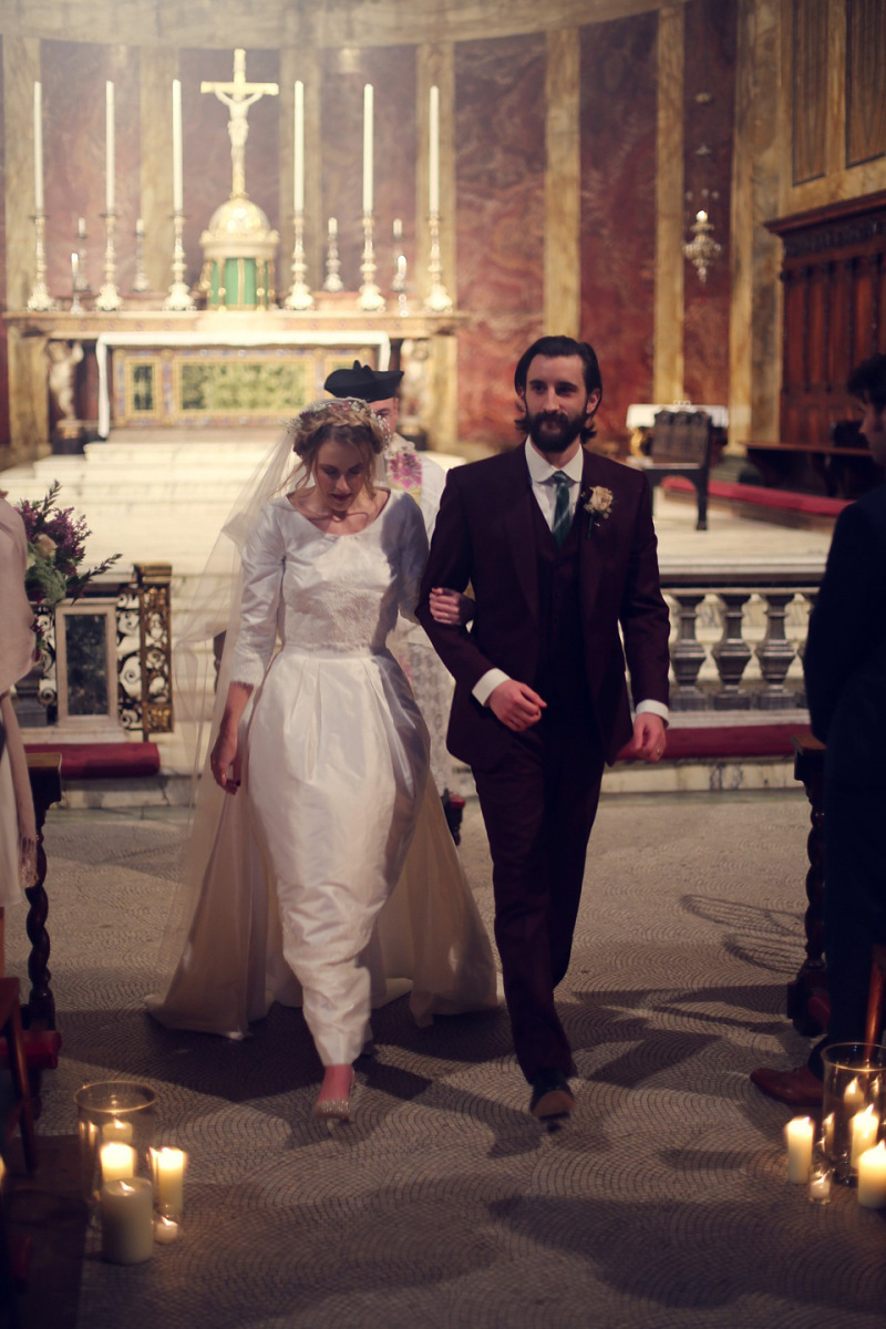 church decorated with glass cylinder candles down the aisles (1)