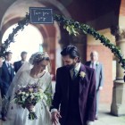 hand held floral arch for bride and groom