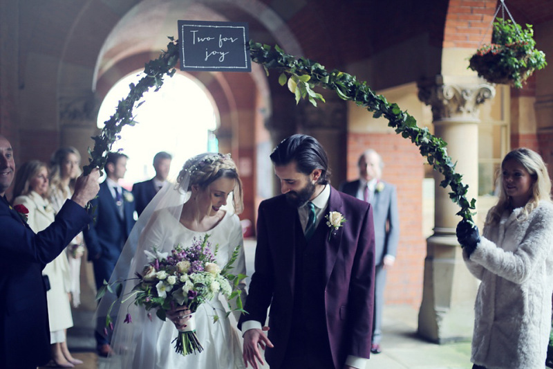 hand held floral arch for bride and groom