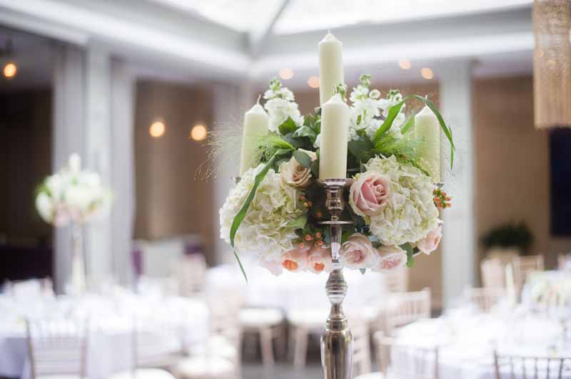 Candelabra centrepiece Hampton Manor Wedding Flowers Passion for Flowers