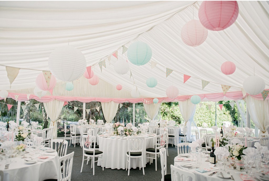 Pastel Paper Lanterns Hanging from Marquee Ceiling