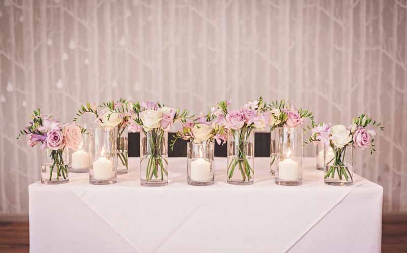 ceremony table flowers glass vases - elegant wedding flowers at hampton manor by passion for flowers