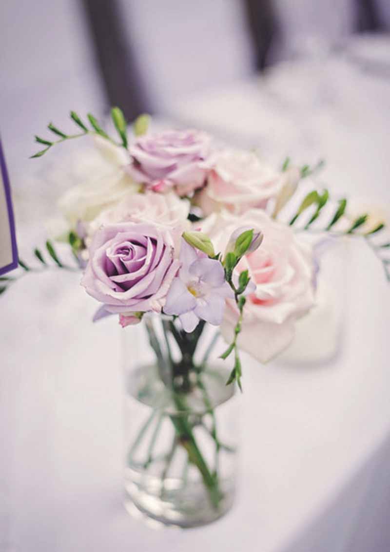 glass cylinder vases as wedding centrepieces lilac roses and freesia by passion for flowers