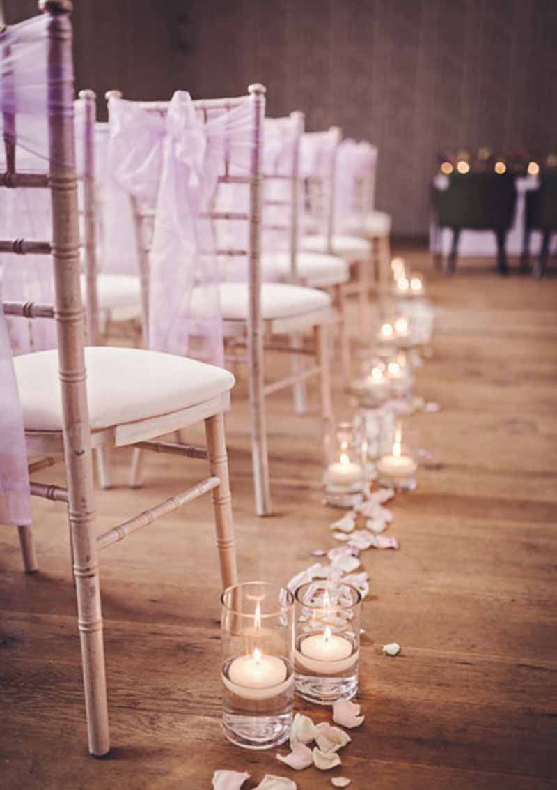 glass vases with candles aisle decorations with fresh rose petals - elegant wedding flowers at hampton manor wedding ceremony by passion for flowers