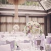 tall glass vases wedding centrepieces lilac and white flowers at hampton manor wedding flowers by passion for flowers