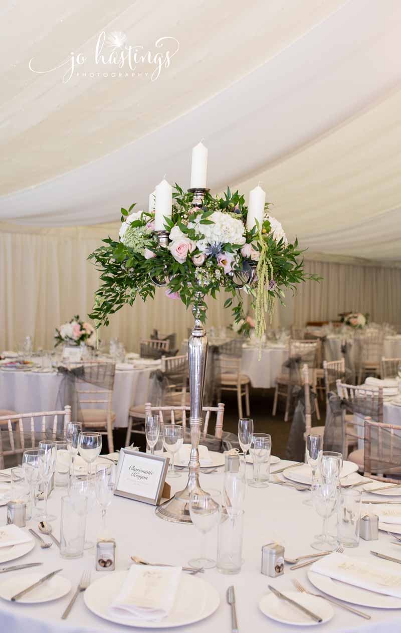 1m tall candelara wedding centrepieces marquee wedding - florist Passion for Flowers based in West Midlands UK