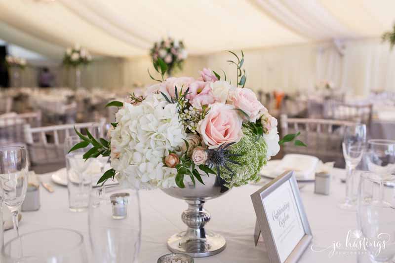 Silver footed bowl centrepieces with blush pink roses, dusty blue thistles white hydrangeas and foligae at Heath House wedding (1)