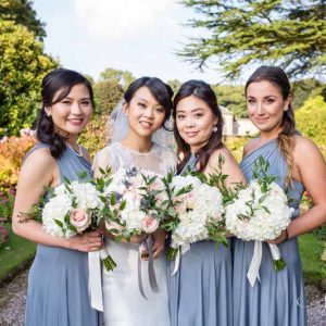 dusty blue bridesmaids dresses dusky pink roses, blue thistles and white hydrangea bouquets (1)