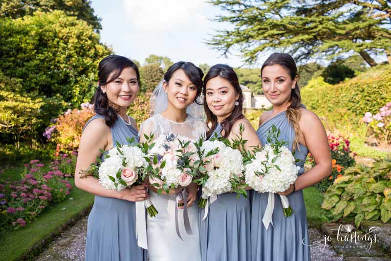 dusty blue bridesmaids dresses dusky pink roses, blue thistles and white hydrangea bouquets (1)