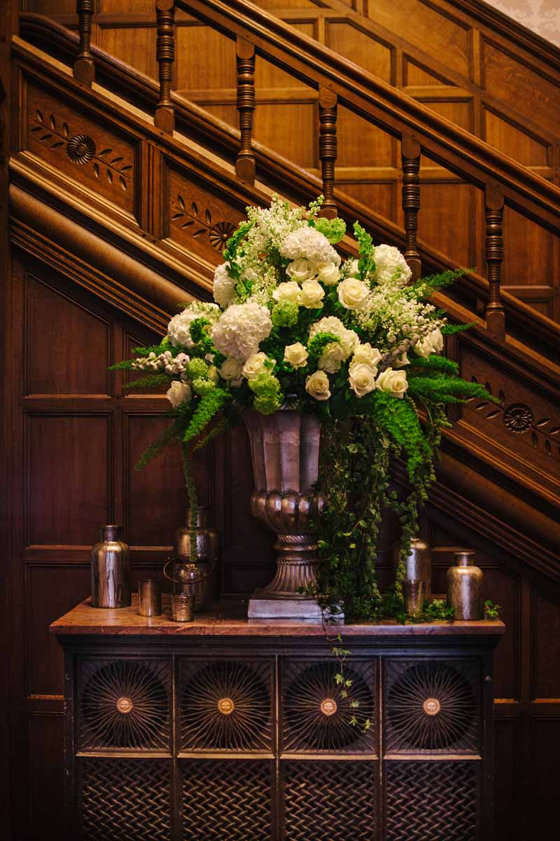 Elegant gold urn welcome flowers by @kmorganflowers Passion for Flowers at Hampton Manor