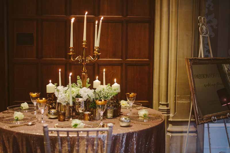 Elegant gold wedding centrepieces candleabra with white flowers by Passion for Flowers @kmorganflowers (2)