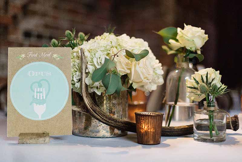 Gold-vases-cream-hydrangeas-antlers-and-bronze-tea-lights-by-Florist-Passion-for-Flowers-@kmorganflowers