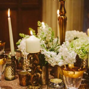 Gold wedding centrepieces add lots of gold vases and vessels around the base of candelabra for more impact on your tables By @kmorganflowers (1)