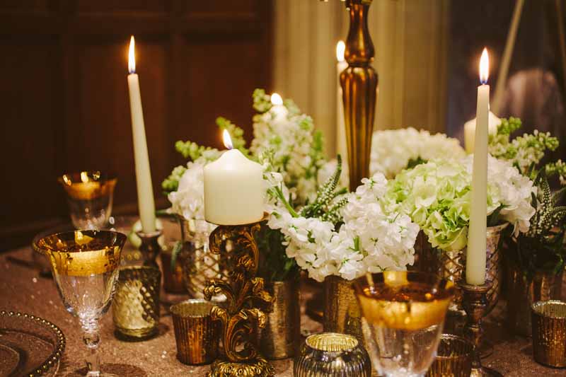 Gold wedding centrepieces add lots of gold vases and vessels around the base of candelabra for more impact on your tables By @kmorganflowers (1)