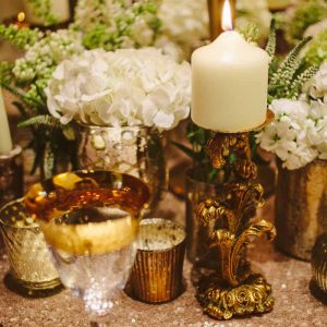 Gold wedding centrepieces add lots of gold vases and vessels around the base of candelabra for more impact on your tables By @kmorganflowers (2)