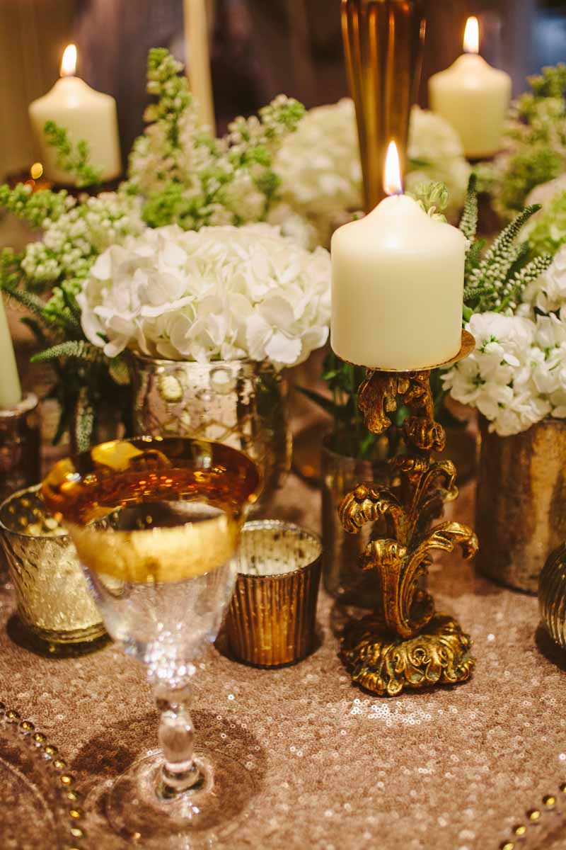 Gold wedding centrepieces add lots of gold vases and vessels around the base of candelabra for more impact on your tables By @kmorganflowers (2)