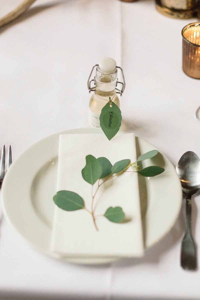 Pretty-place-settings-a-snippet-of-eucalyptus-Florist-Passion-for-Flowers-@kmorganflowers