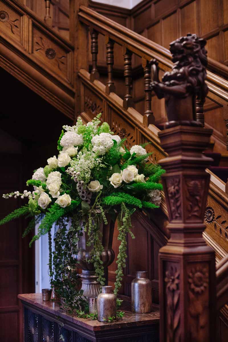 Stunning gold urn with antique gold vases and vessels around the base on a wedding entrance table by @kmorganflowers (2)