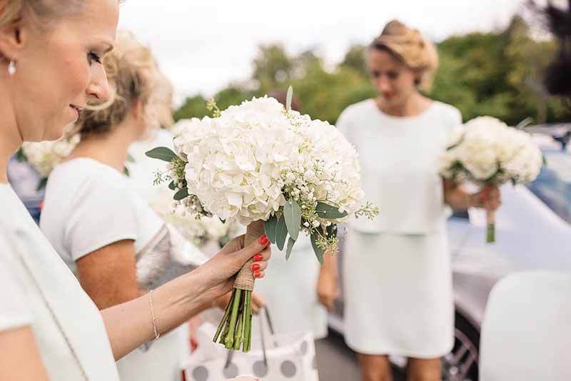 White-hydrangeas-bouquets-at-Shustoke-Farm-Barns-by-Passion-for-Flowers-@kmorganflowers