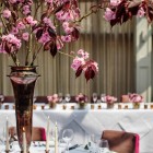 Tall centrepices bright pink blossom in bronze vases at Hampton Manor - flowers by Passion for Flowers @kmorganflowers