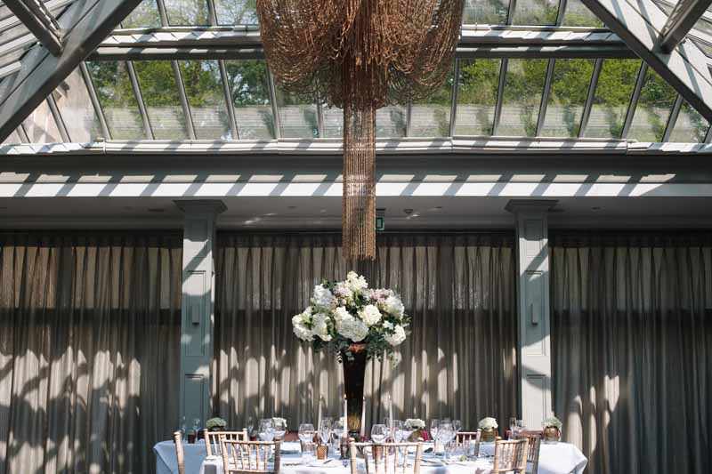 Tall wedding centrepiece bronze vases with classic white flowers at Hampton Manor Wedding - flowers by Passion for Flowers @kmorganflowers 