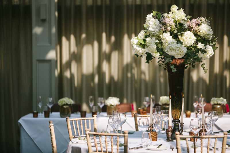 Tall wedding centrepiece bronze vases with classic white flowers at Hampton Manor Wedding - flowers by Passion for Flowers @kmorganflowers