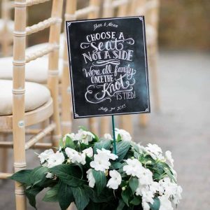 Chalkboard choose a seat not a side ceremony sign at Wethele Manor