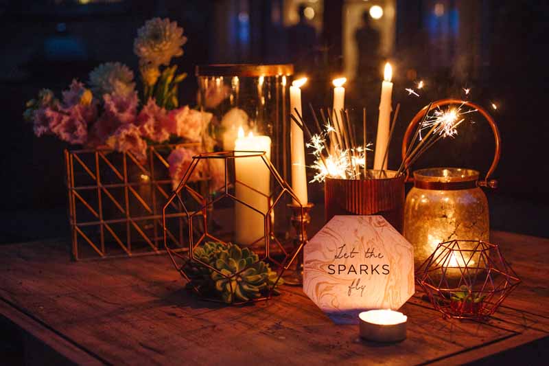 Hampton Manor outdoor seating area styled with flowers and sparklers by Hampton Manor