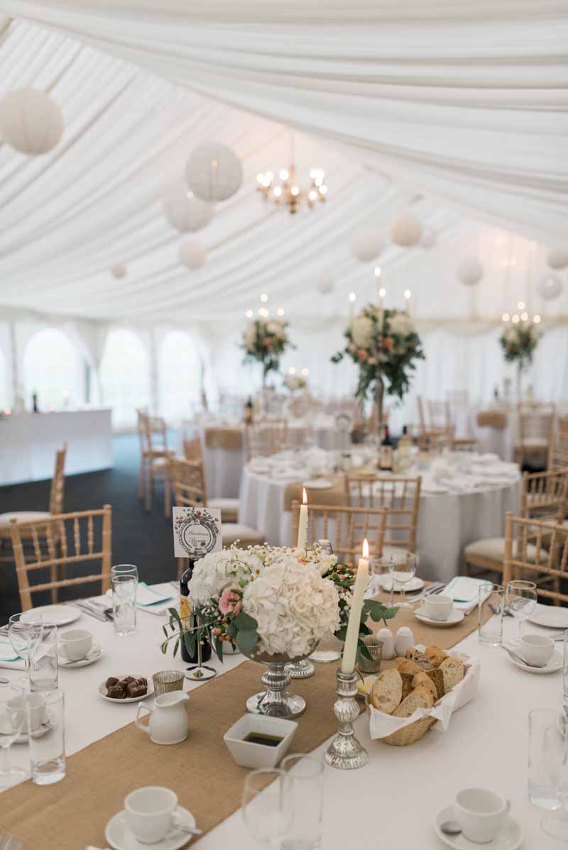 Marquee-wedding-at-Wethele-Manor-footedbowl-centrepieces-mixed-with-candelabra-centrepieces-for-summer-wedding.jpg
