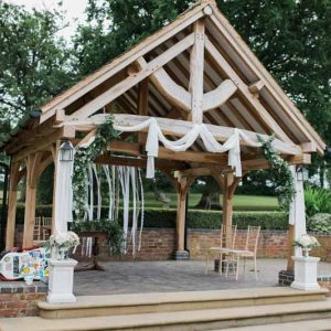 Outdoor wedding ceremony at Wethele Manor drapes and flowers by @kmorganflowers