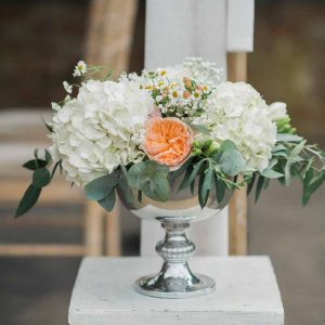 Peach and cream flowers for outdoor wedding ceremony at Wethele Manor