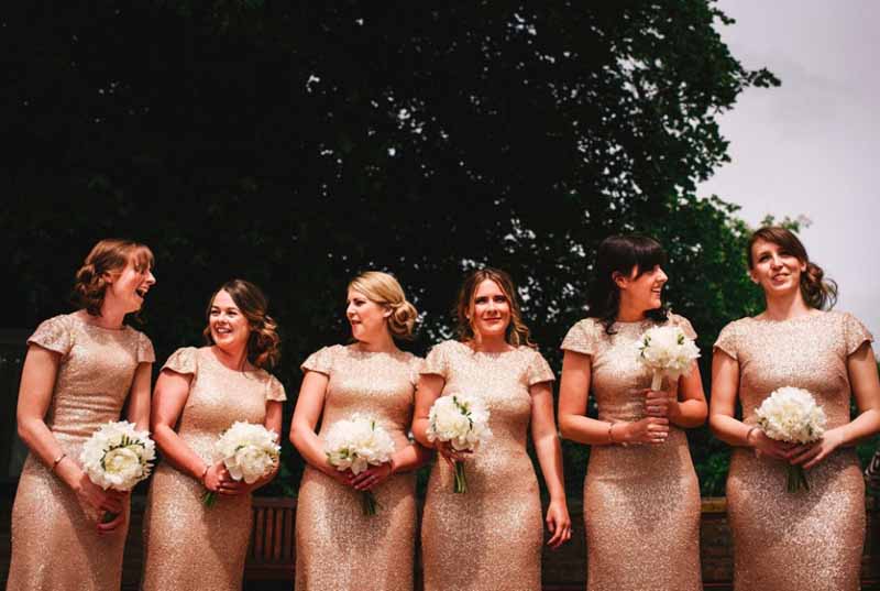 gold glitter bridesmaids dresses white peony bouquets by passion for flowers at curradine barns