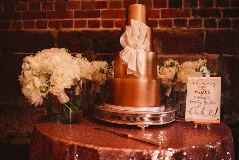 gold wedding cake glitter wedding table cloth with bouquet by passion for flowers cake sign by polly and me