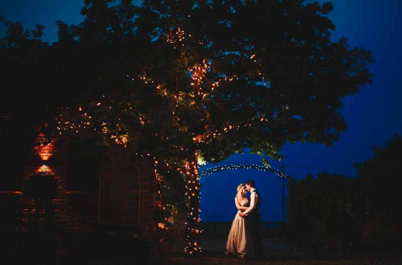 lights on trees at weddings evening photographs curradine barns