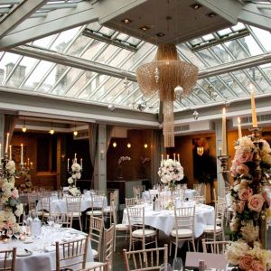 Elegant centrepieces at Hampton Manor - Passion for Flowers Candelabra centrepieces