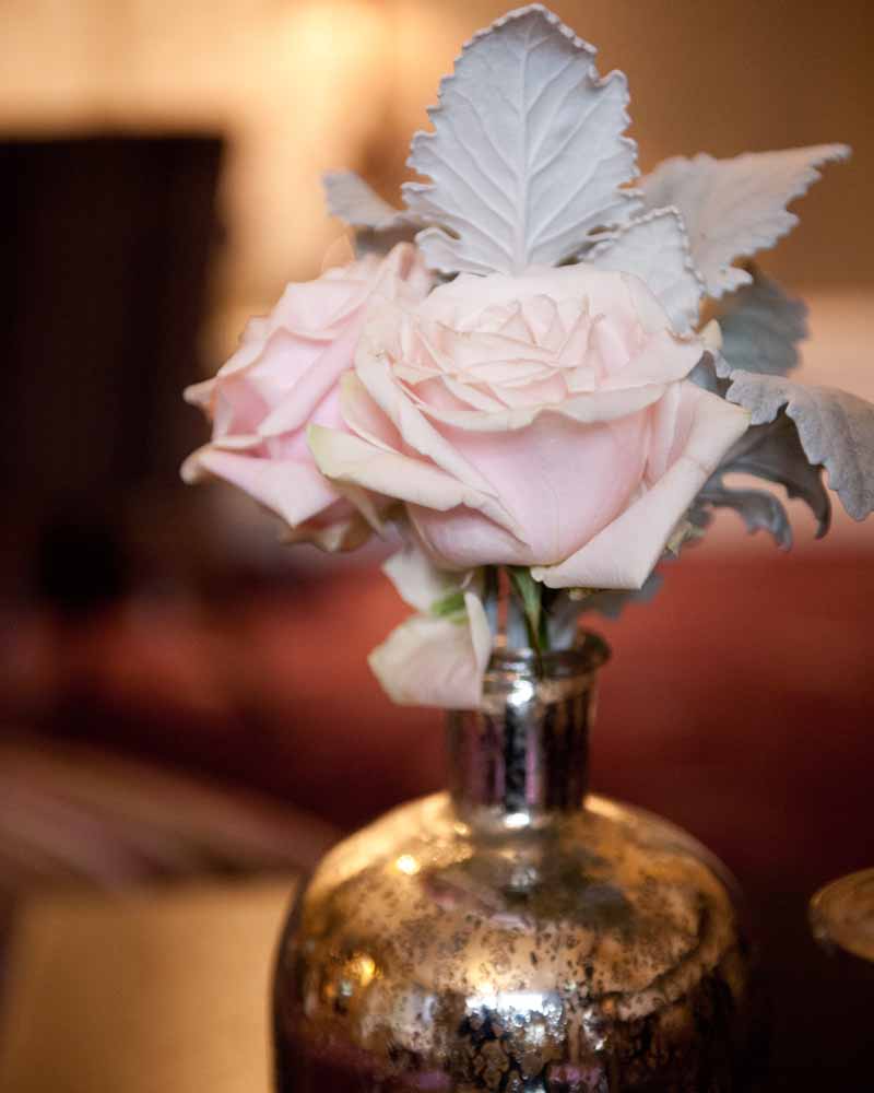 Mercury silver bottles and candle light with blush pink roses - winter wedding Hampton Manor by Passion for Flowers @kmorganflowers