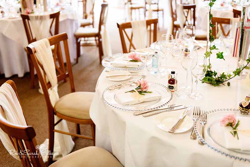 Place settings use flowers on the napkins