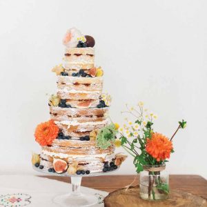 Rustic wedding cake flowers for summer wedding orange and yellow by Passion for Flowers @kmorganflowers
