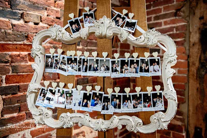 how to display photos at weddings with frame and wooden heart pegs