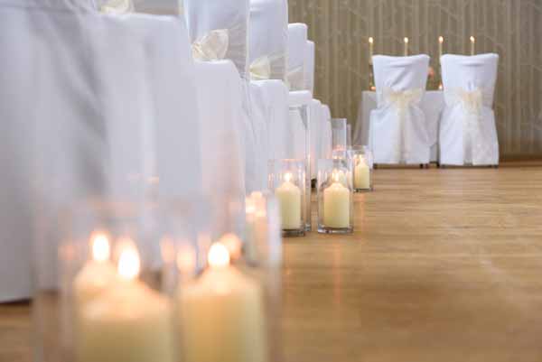 cylinder-vase-lanterns-down-the-aisle-indoor-wedding-ceremony