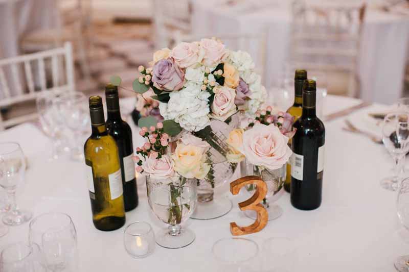 elegant-colourful-wedding-centrepieces-with-gold-table-numbers