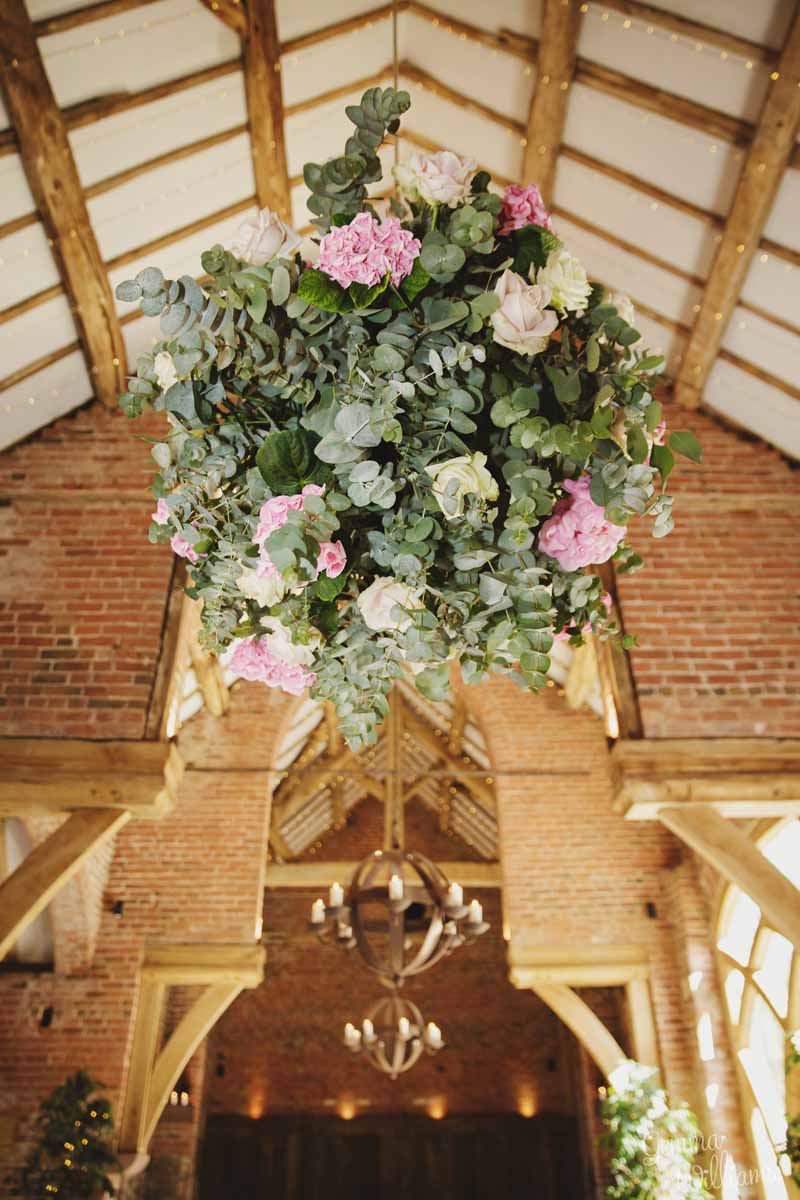 Extra-large-hanging-flower-balls-at-barn-weddings-by-Passion-for-Flowers-@kmorganflowers